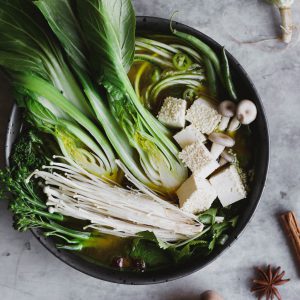 Nutra Organics Bone Broth in bowl of fresh vegetables