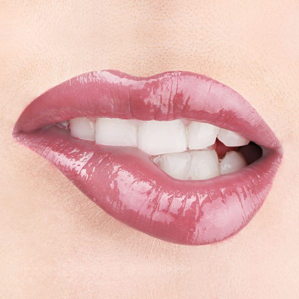 Raww - Coconut Splash Lip Gloss in the shade of Sea Curls closeup image on a woman's lips