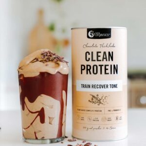 Nutra Organics Clean Protein Chocolate Thickshake Flavour Smoothie with product container on a kitchen table