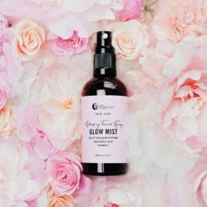Nutra Organics Glow Mist Hydrating Facial Spray in a 100 ml bottle styled image with pink roses